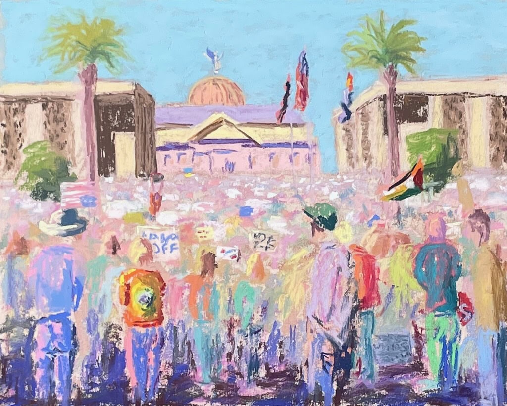 A crowd of protesters gathered in front of the Arizona State Capitol in Phoenix, AZ