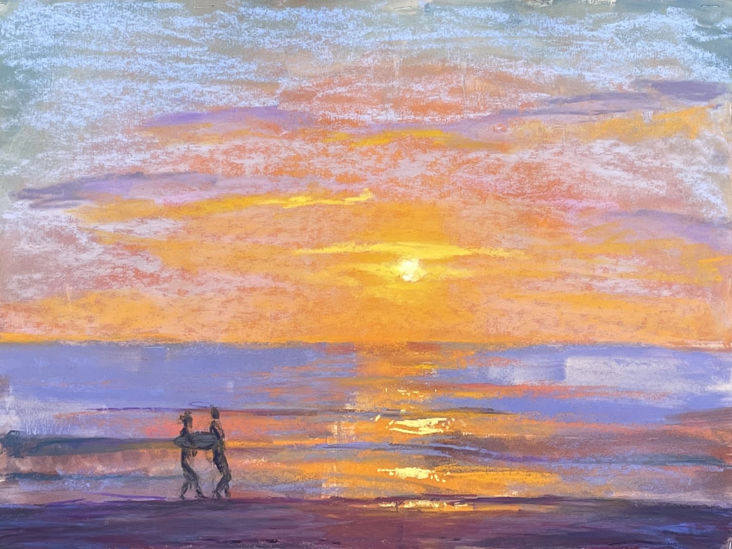 sunset over ocean with silhouettes of two surfers walking along water line